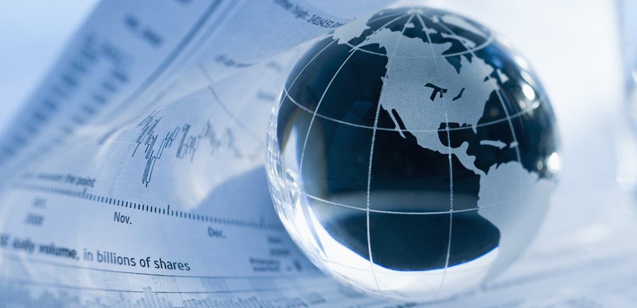 A globe on business papers