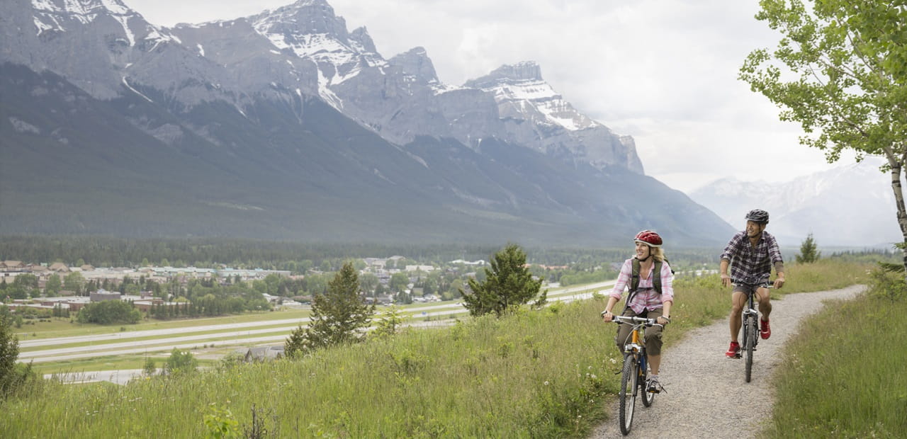 Couple biking outdoors.